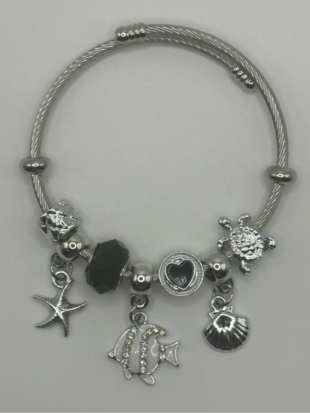 Silver Sea Charm Bracelet with Black Accent Bead